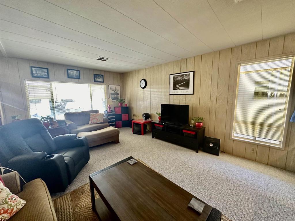 8301 Mission Gorge Road, Unit 194 Santee, CA 92071 - Photo 15 of 61 a living room with furniture and a flat screen tv