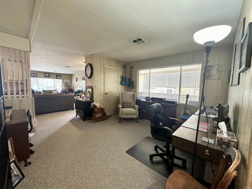 8301 Mission Gorge Road, Unit 194 Santee, CA 92071 - Photo 20 of 61 a view of a livingroom with workspace and a couch