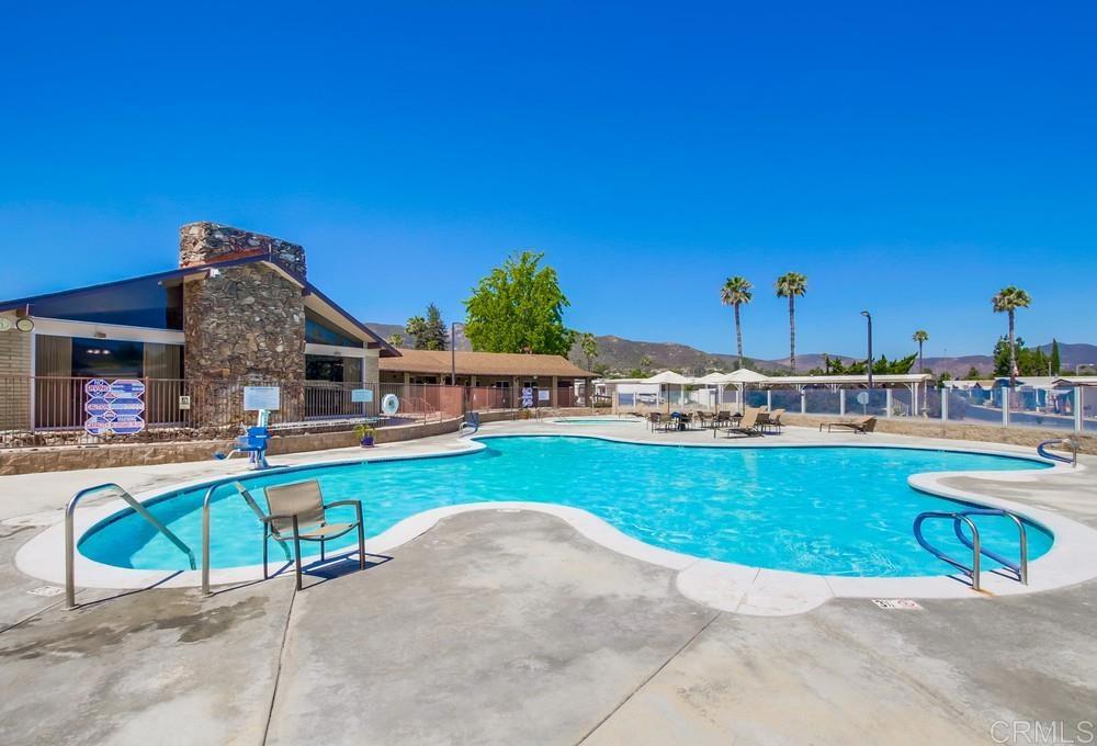 8301 Mission Gorge Road, Unit 194 Santee, CA 92071 - Photo 2 of 61 a view of a house with pool and a chairs