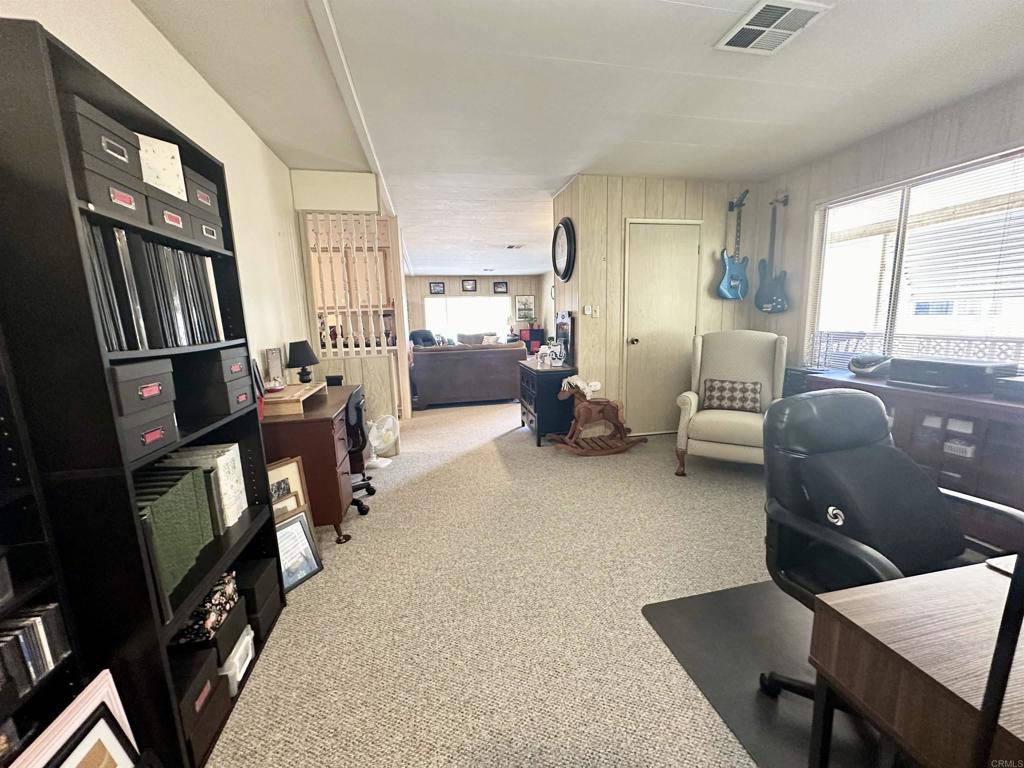 8301 Mission Gorge Road, Unit 194 Santee, CA 92071 - Photo 22 of 61 a living room with furniture fireplace and a window