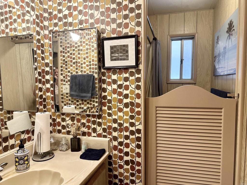 8301 Mission Gorge Road, Unit 194 Santee, CA 92071 - Photo 25 of 61 a bathroom with a sink and a mirror