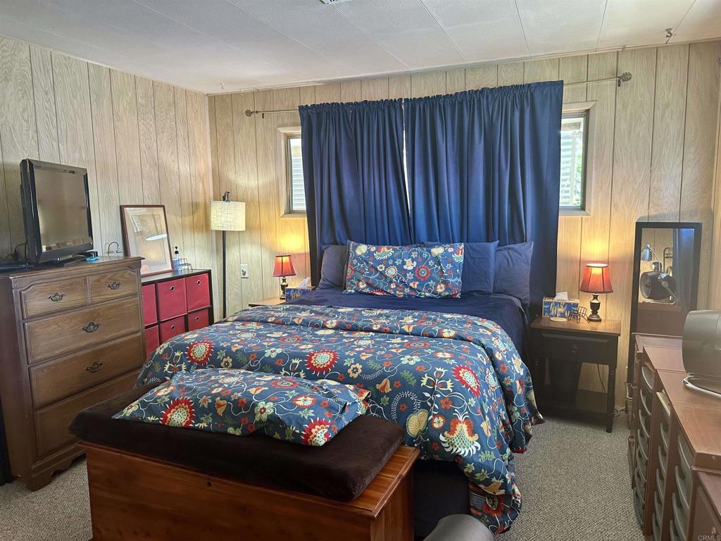 8301 Mission Gorge Road, Unit 194 Santee, CA 92071 - Photo 35 of 61 a bedroom with a bed and wooden floor