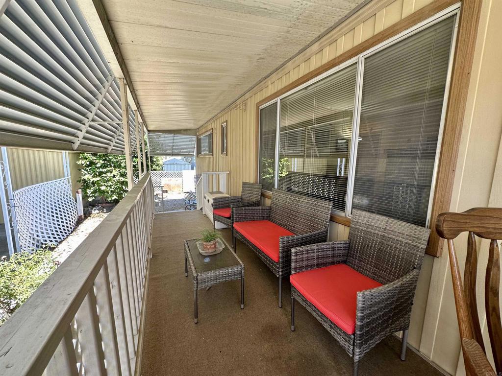 8301 Mission Gorge Road, Unit 194 Santee, CA 92071 - Photo 40 of 61 a balcony with furniture and wooden floor