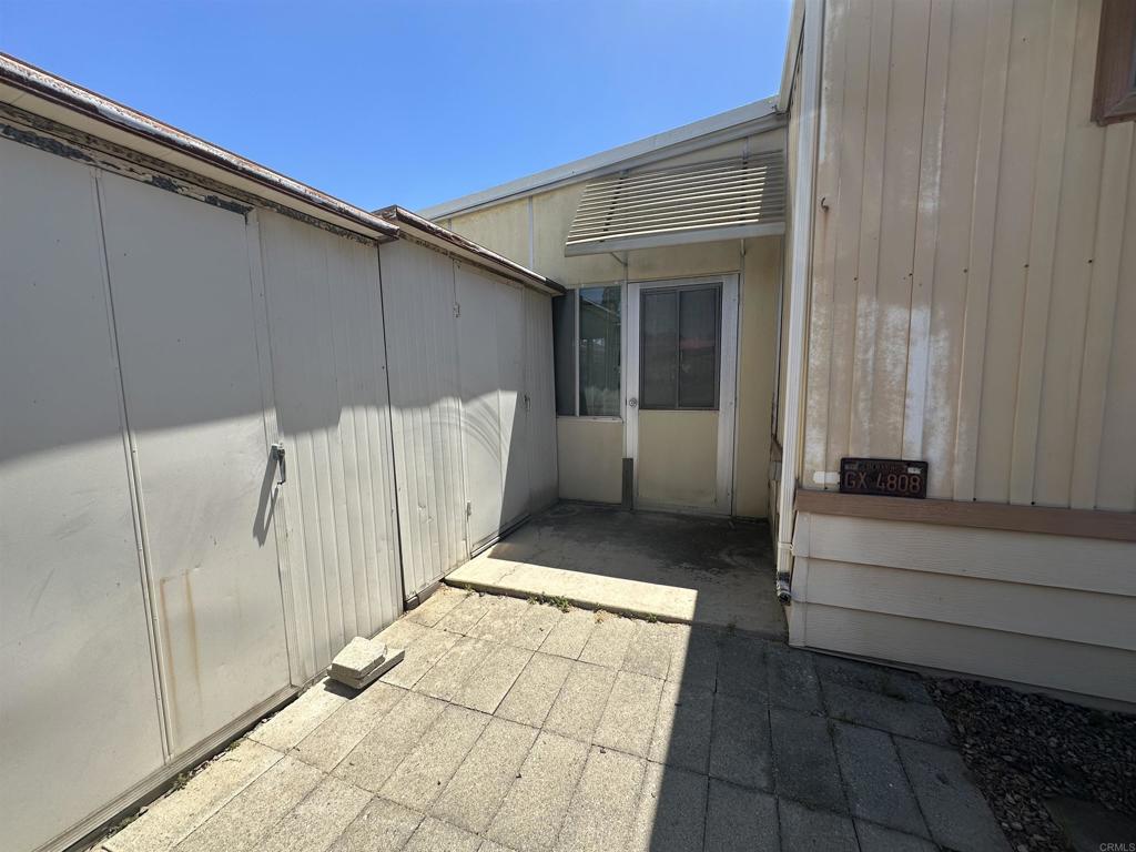 8301 Mission Gorge Road, Unit 194 Santee, CA 92071 - Photo 49 of 61 a view of a porch with a table and chairs