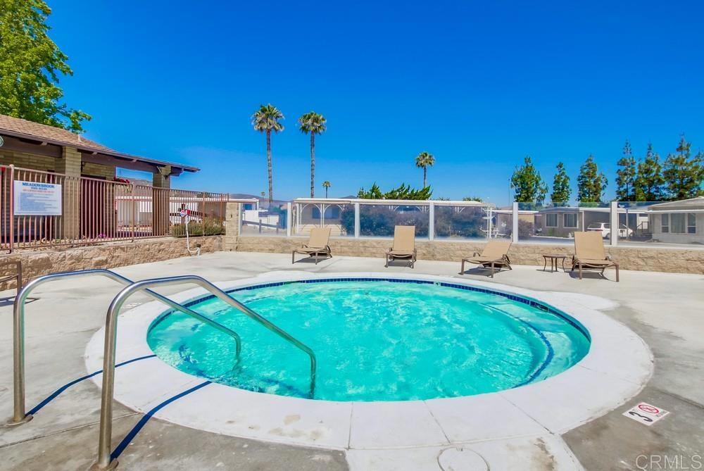 8301 Mission Gorge Road, Unit 194 Santee, CA 92071 - Photo 54 of 61 a view of a swimming pool with a lounge chair