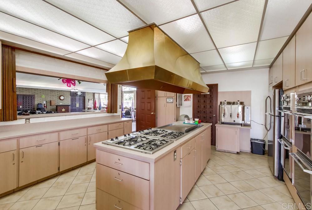 8301 Mission Gorge Road, Unit 194 Santee, CA 92071 - Photo 59 of 61 a kitchen with a stove and a refrigerator