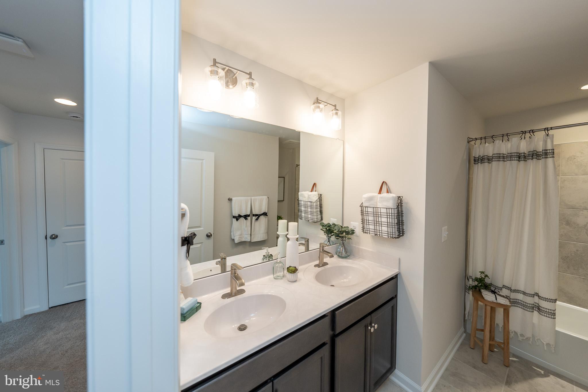 121 Indian Hills Road Locust Grove, VA 22508 - Photo 22 of 26 a bathroom with a sink and a mirror
