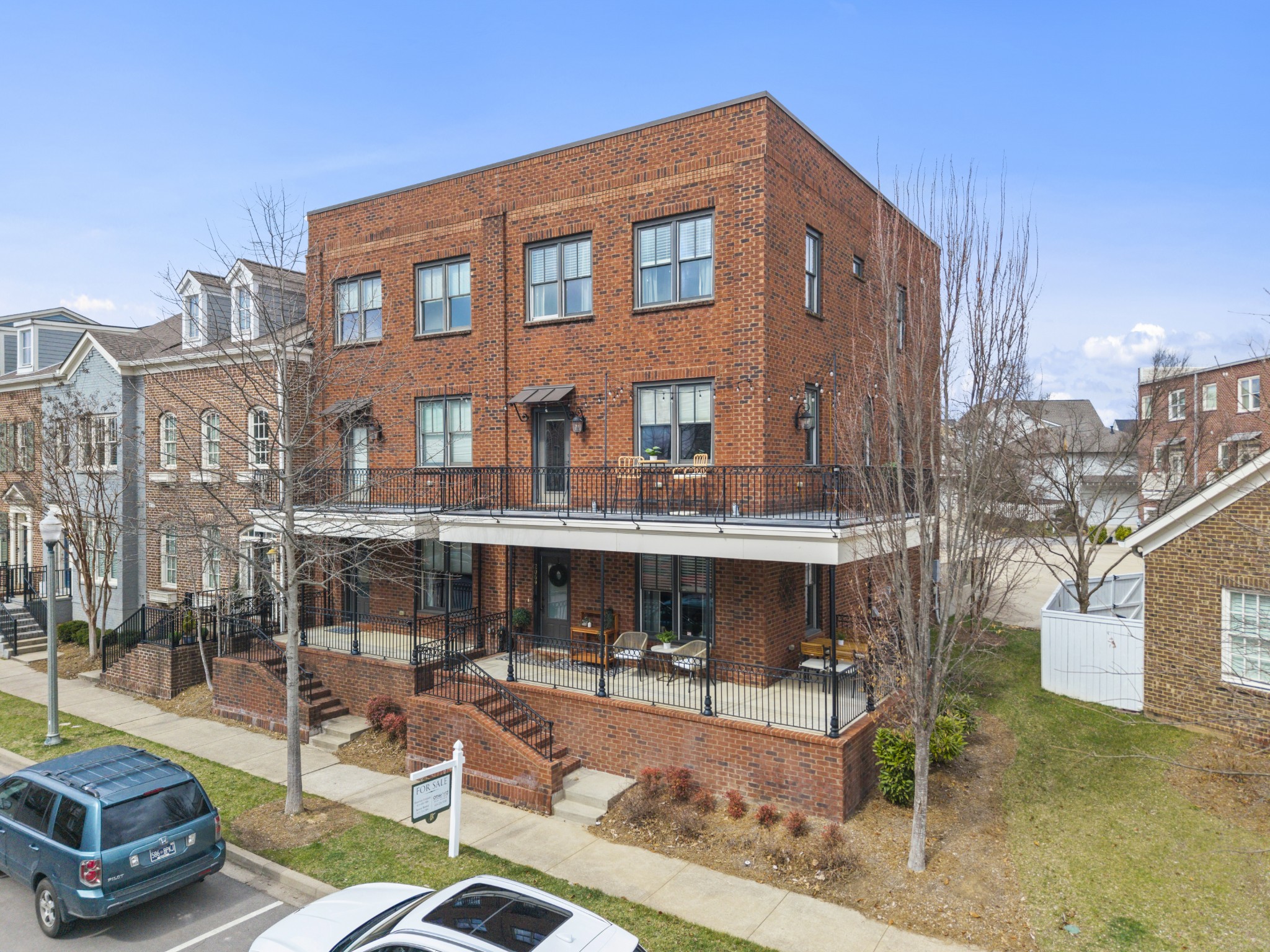 a view of a patio with table and chairs and potted plants