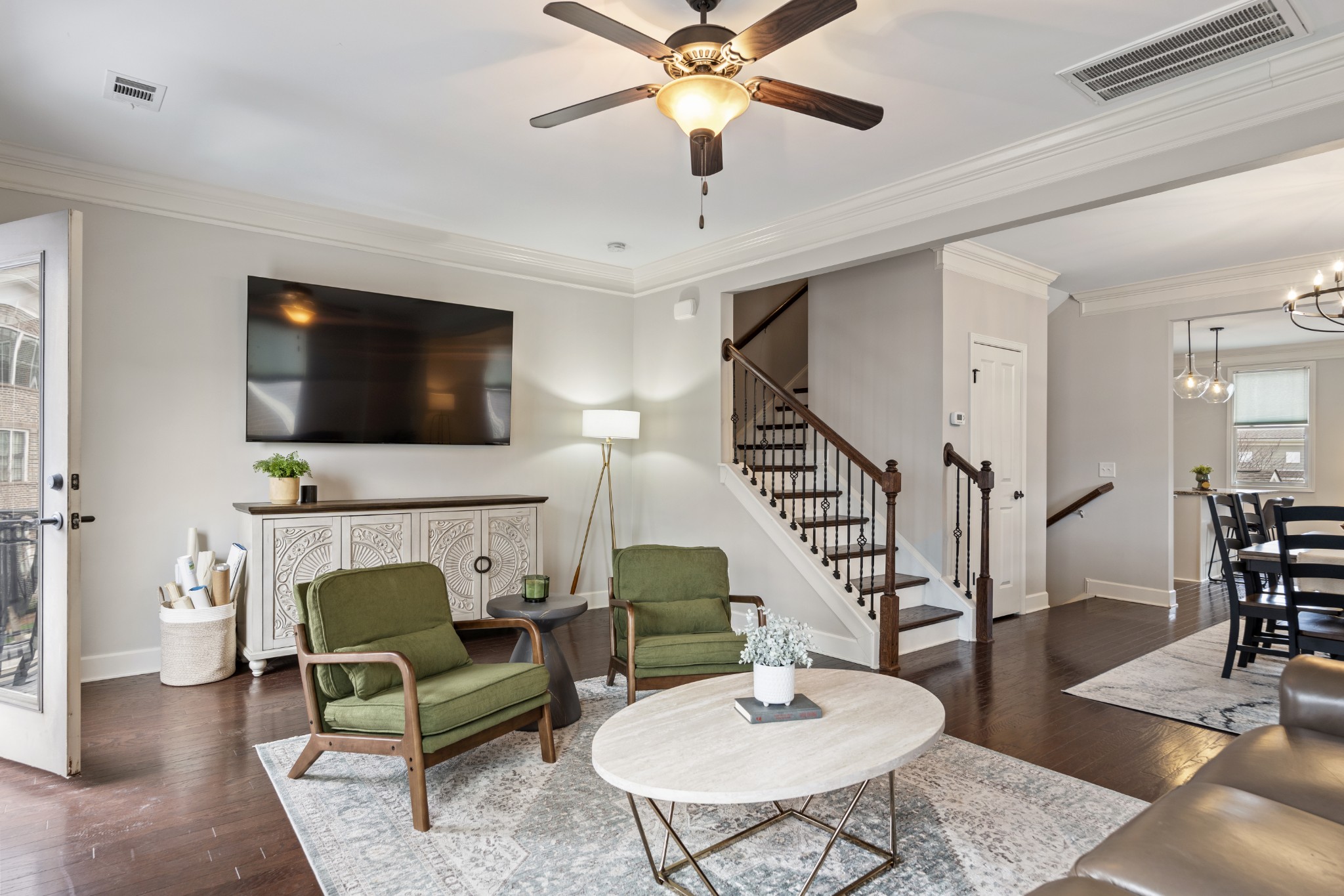 2069 Rural Plains Circle Franklin, TN 37064 - Photo 13 of 74 a living room with furniture a fireplace and a flat screen tv