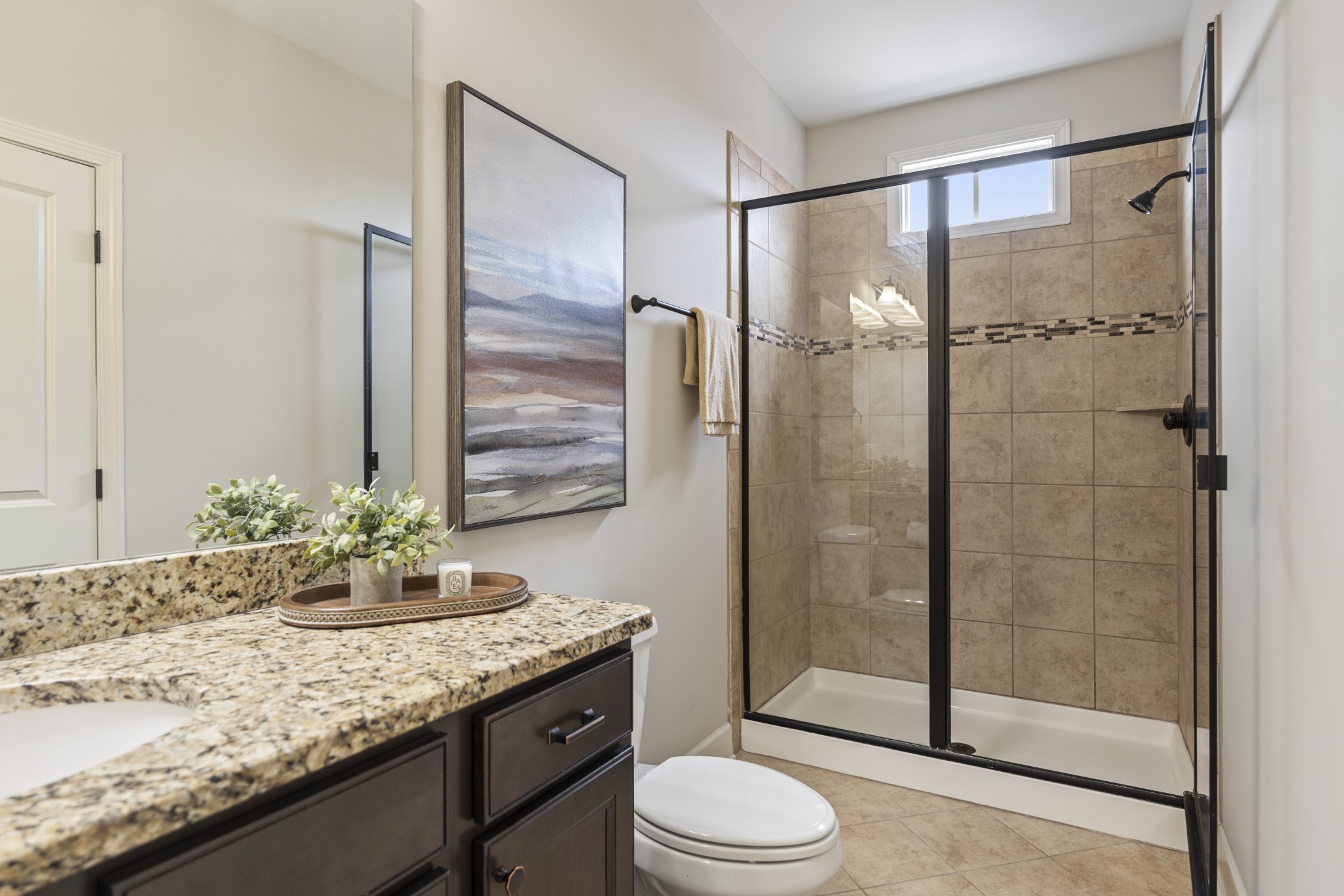 2069 Rural Plains Circle Franklin, TN 37064 - Photo 17 of 74 a bathroom with a granite countertop sink a toilet and shower