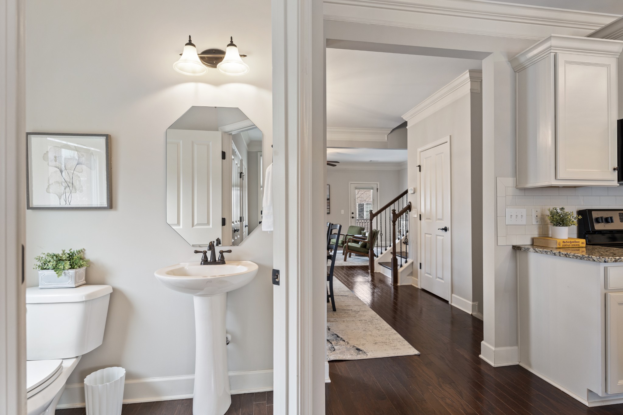 2069 Rural Plains Circle Franklin, TN 37064 - Photo 19 of 74 a view of a hallway with wooden floor windows and a chandelier