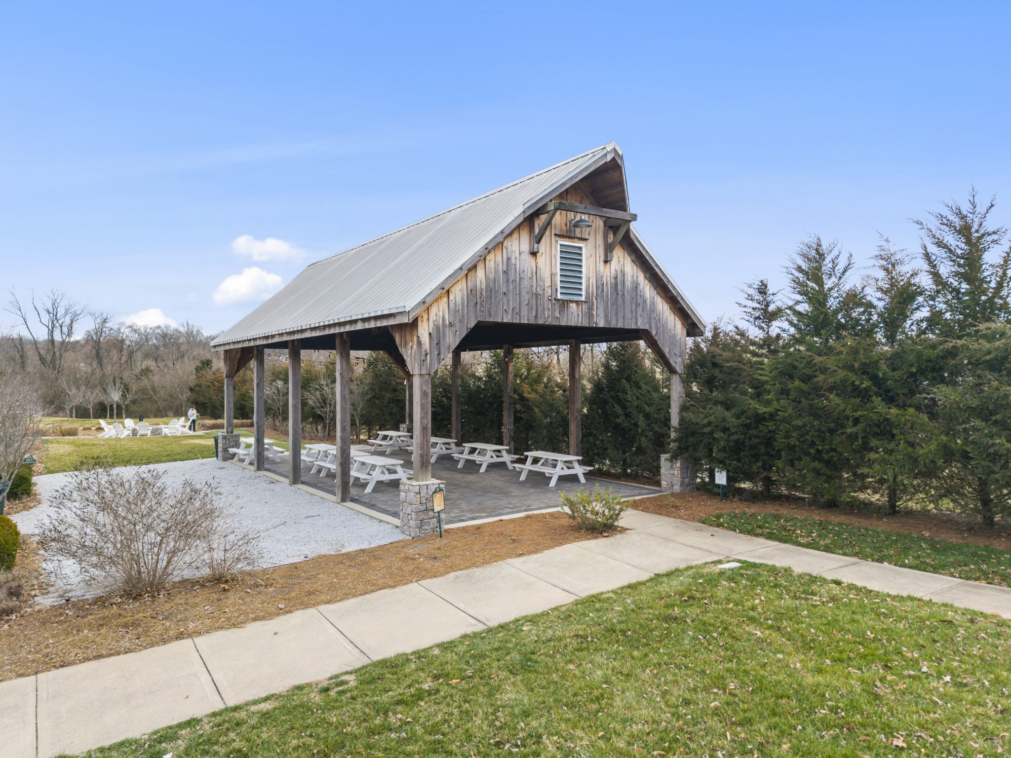 2069 Rural Plains Circle Franklin, TN 37064 - Photo 50 of 74 a backyard of a house with basket ball court tables and chairs