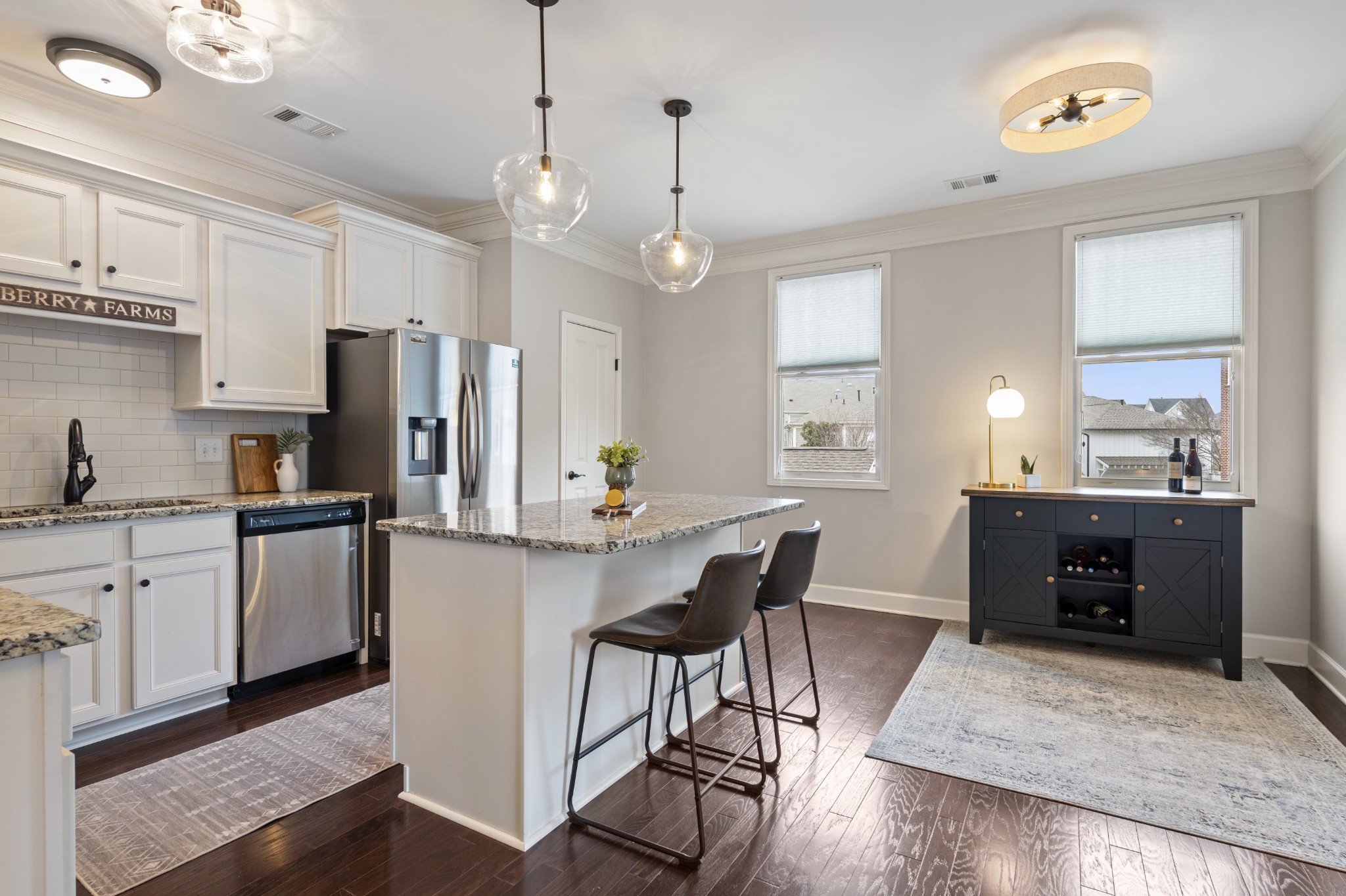 2069 Rural Plains Circle Franklin, TN 37064 - Photo 5 of 74 a kitchen with stainless steel appliances a dining table chairs refrigerator and stove