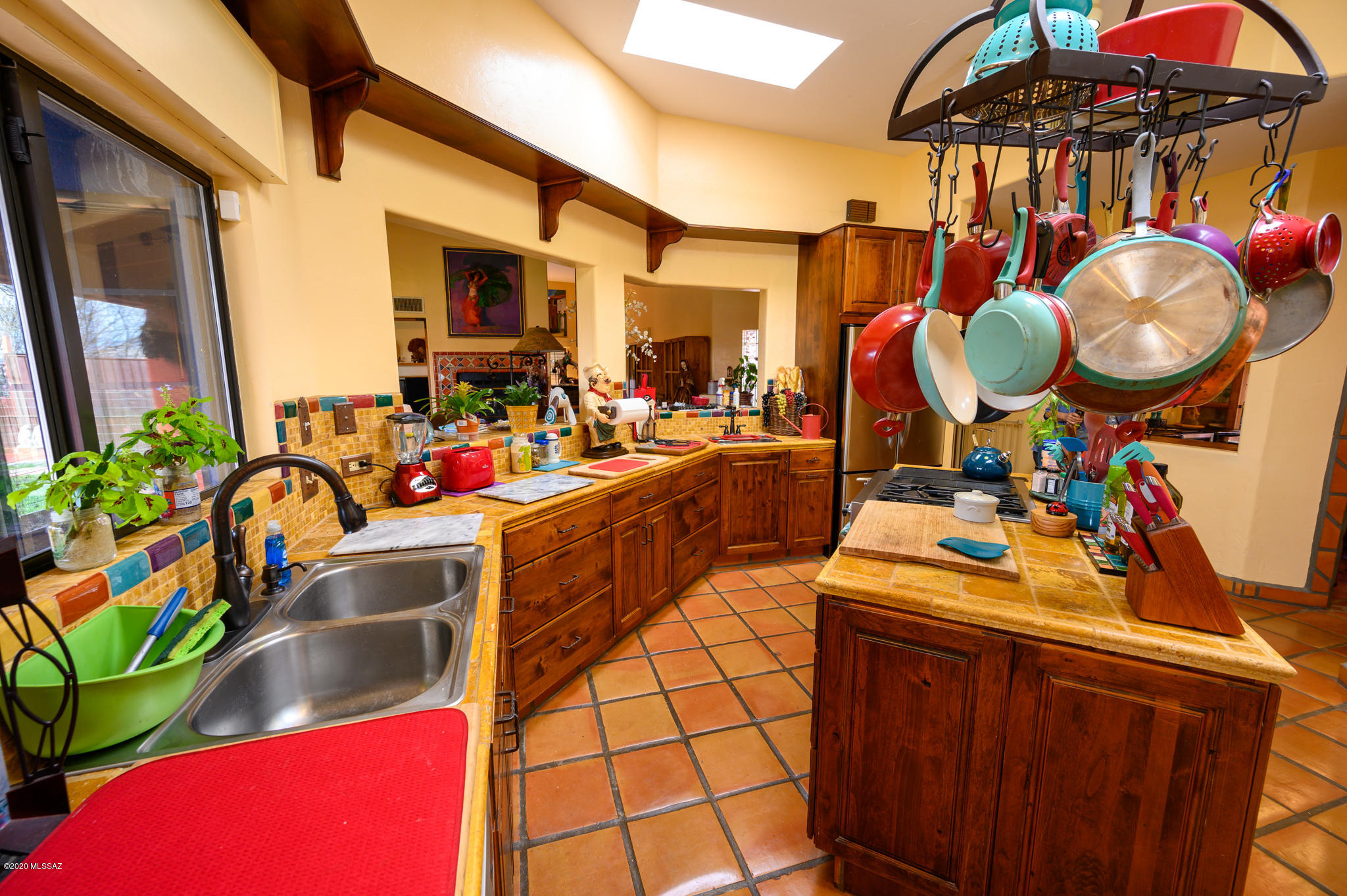 893 Gecko Lane Rio Rico, AZ 85648 - Photo 21 of 40 a view of a kitchen with a sink and cabinets