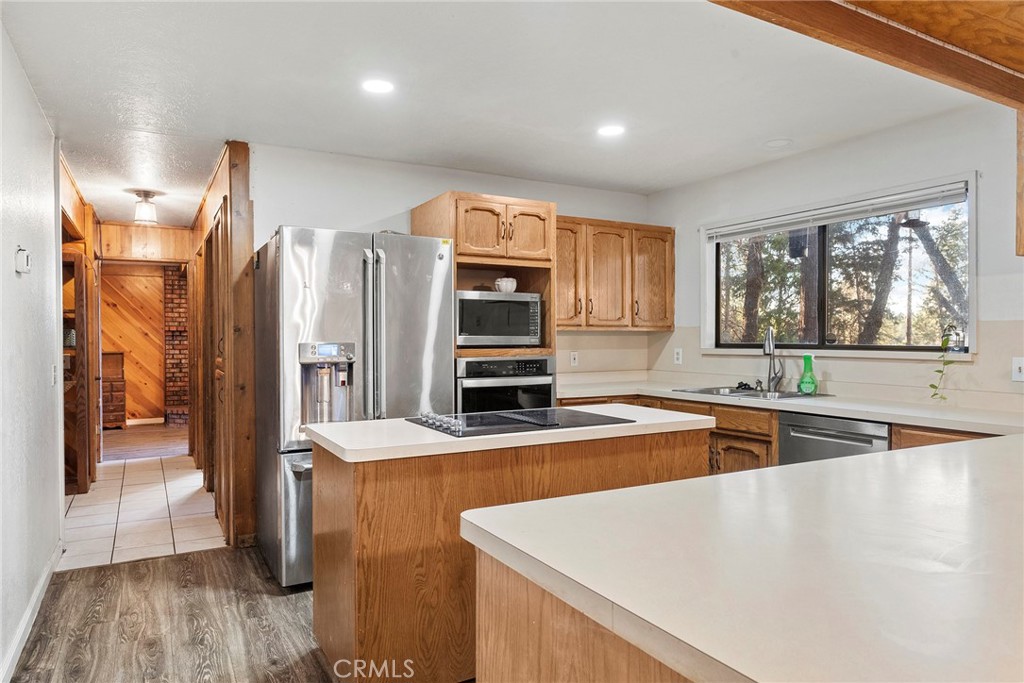 14177 Racine Circle Magalia, CA 95954 - Photo 12 of 52 a kitchen with stainless steel appliances granite countertop a refrigerator and a sink