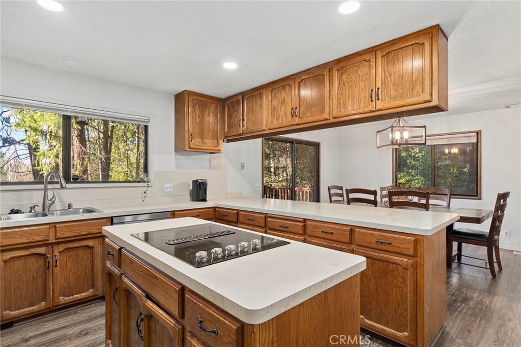 14177 Racine Circle Magalia, CA 95954 - Photo 15 of 52 a kitchen that has a sink a stove and wooden cabinets