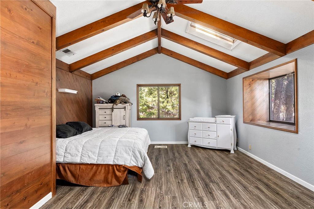 14177 Racine Circle Magalia, CA 95954 - Photo 25 of 52 a bedroom with a bed and wooden floor