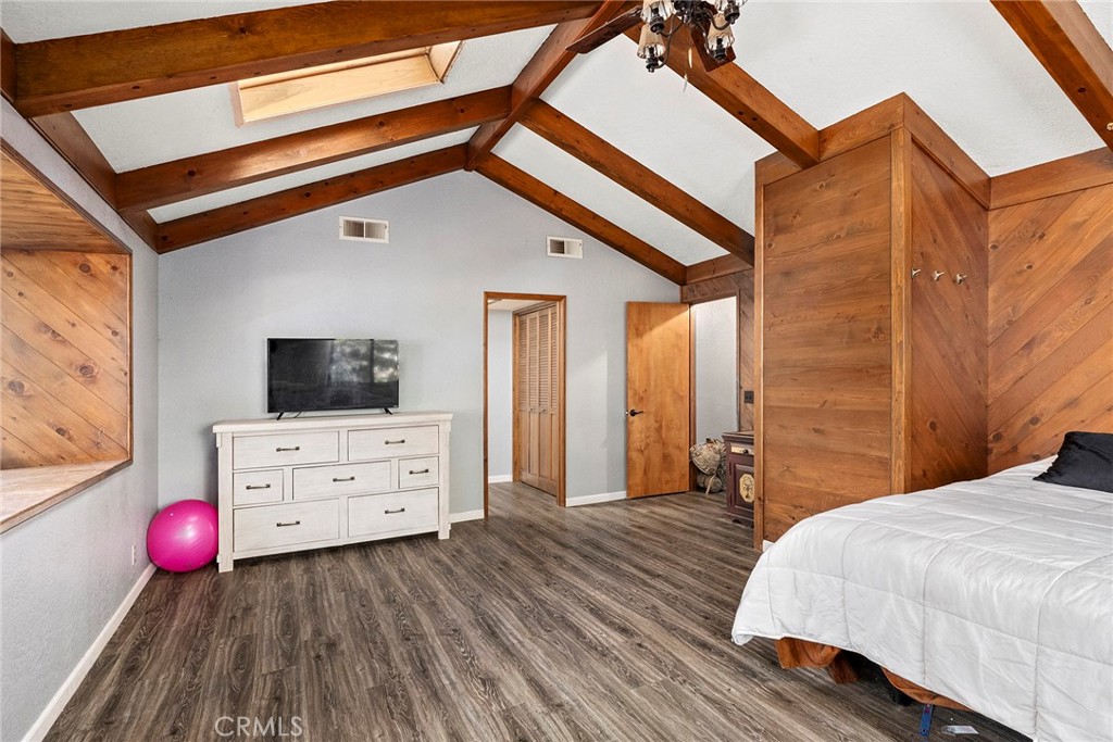 14177 Racine Circle Magalia, CA 95954 - Photo 27 of 52 a bedroom with a bed and wooden floor
