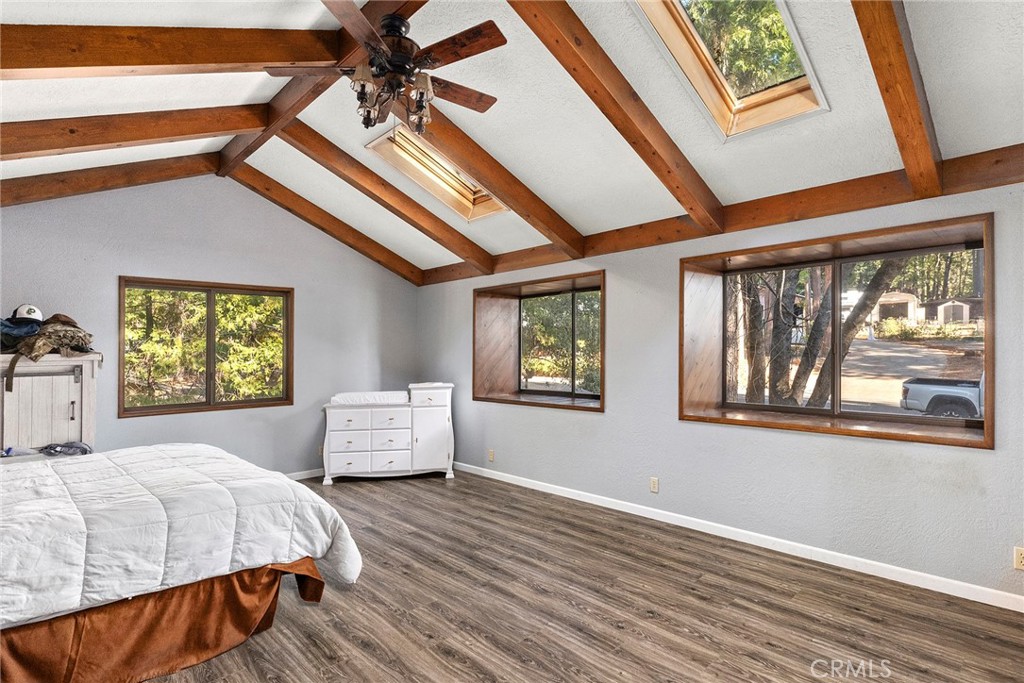 14177 Racine Circle Magalia, CA 95954 - Photo 28 of 52 a bedroom with a bed and wooden floor