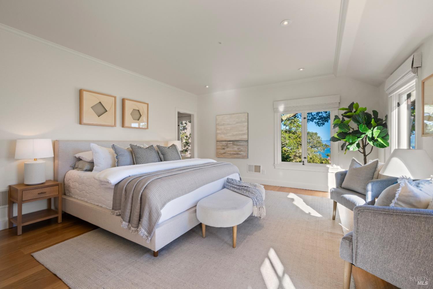 615 Sausalito Boulevard Sausalito, CA 94965 - Photo 24 of 45 a spacious bedroom with a bed and a couch