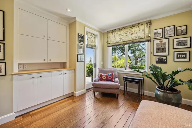 a spacious bedroom with a bed and a flat screen tv