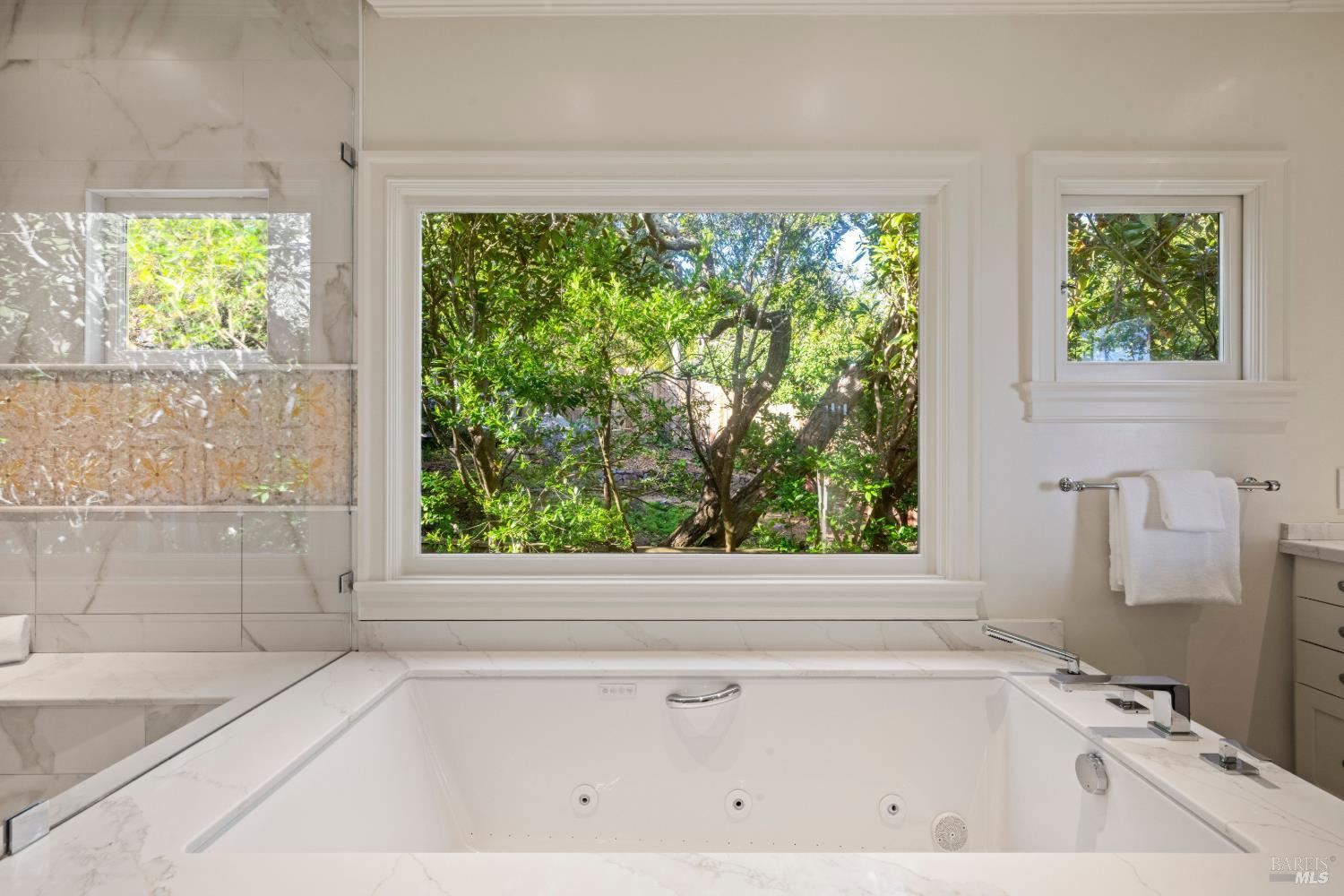 615 Sausalito Boulevard Sausalito, CA 94965 - Photo 34 of 45 a bathroom with a bathtub and window