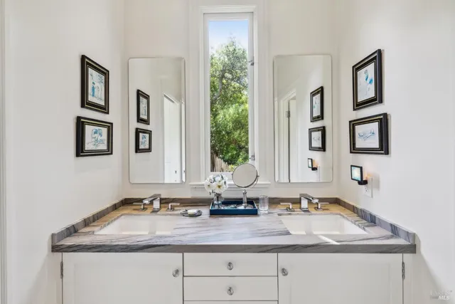 an aerial view of a house with garden space and street view