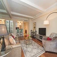 Undisclosed Address Manhattan, NY 10019 - Photo 2 of 6 a living room with furniture and a flat screen tv