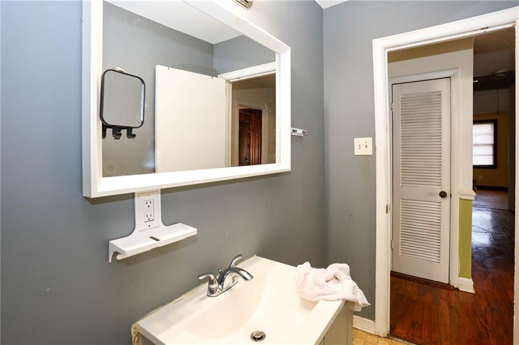 1368 West Austin Road Decatur, GA 30032 - Photo 17 of 42 a bathroom with a sink and a mirror