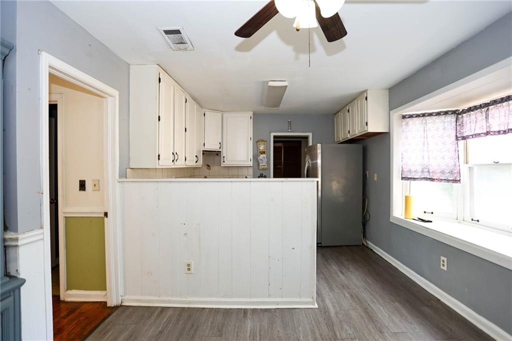 1368 West Austin Road Decatur, GA 30032 - Photo 18 of 42 a kitchen with stainless steel appliances a refrigerator sink and cabinets