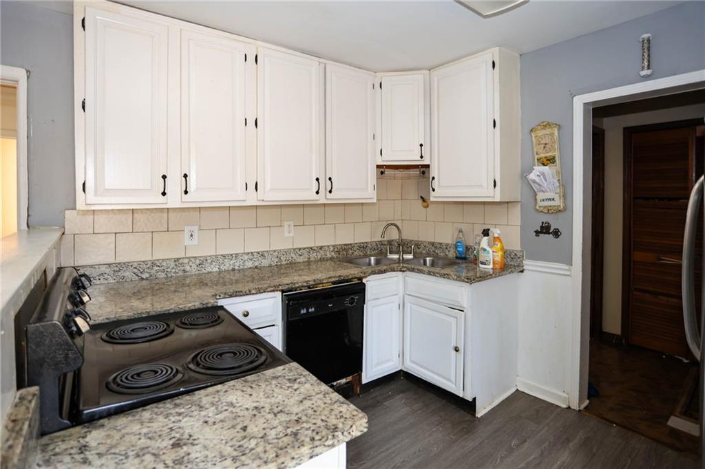 1368 West Austin Road Decatur, GA 30032 - Photo 20 of 42 a kitchen with stainless steel appliances granite countertop a stove a sink and a refrigerator