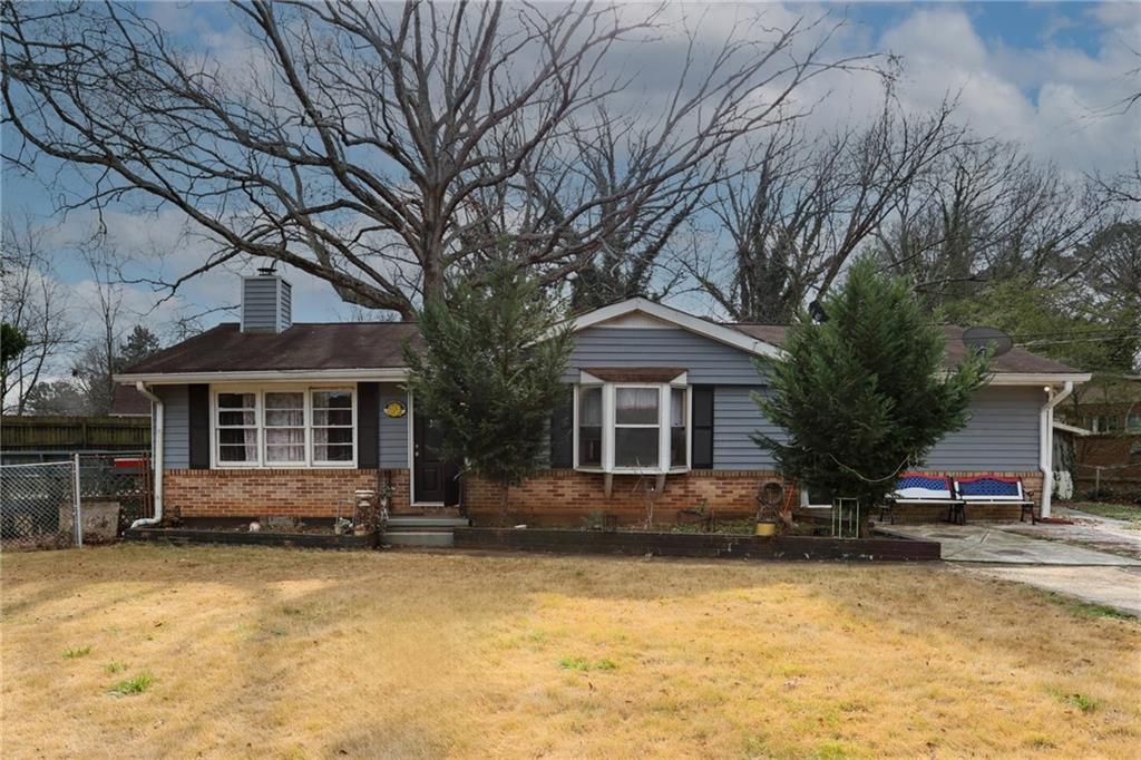 1368 West Austin Road Decatur, GA 30032 - Photo 2 of 42 a front view of house with yard and trees around