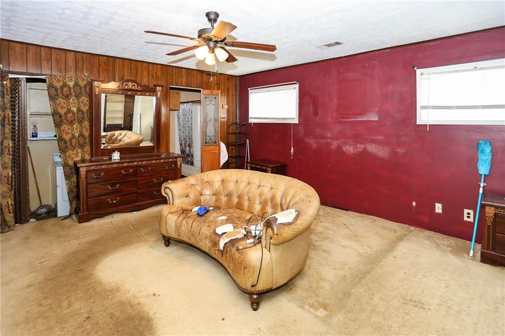 1368 West Austin Road Decatur, GA 30032 - Photo 24 of 42 a bedroom with a bed dresser and a flat tv screen