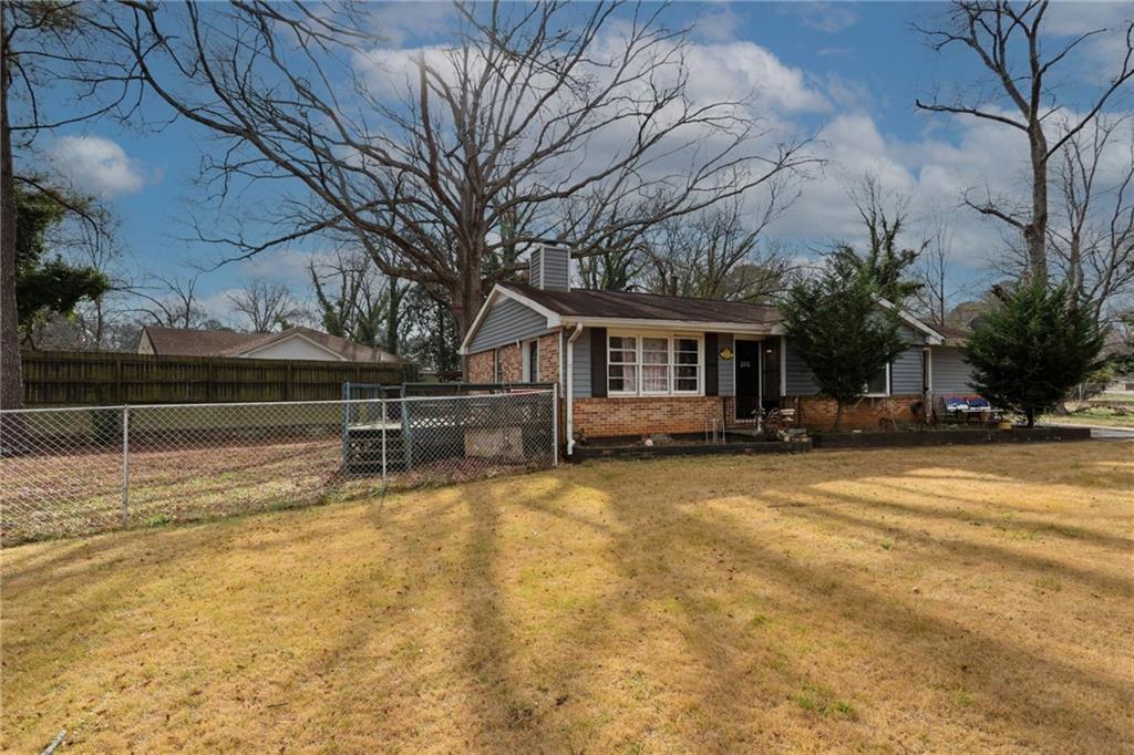 1368 West Austin Road Decatur, GA 30032 - Photo 3 of 42 a front view of house with yard and trees around