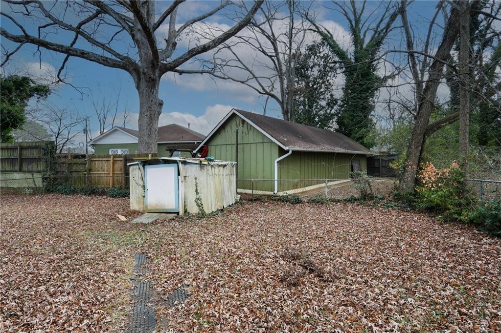 1368 West Austin Road Decatur, GA 30032 - Photo 33 of 42 a view of a house with large trees and a barn