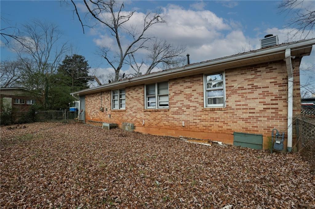 1368 West Austin Road Decatur, GA 30032 - Photo 36 of 42 a backyard of a house with large trees