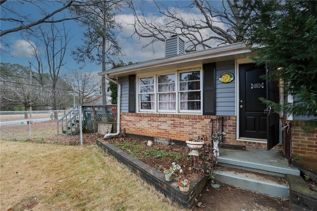1368 West Austin Road Decatur, GA 30032 - Photo 38 of 42 a front view of a house with a garden