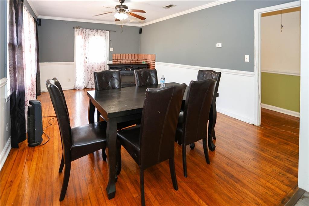 1368 West Austin Road Decatur, GA 30032 - Photo 6 of 42 a view of a dining room with furniture and wooden floor