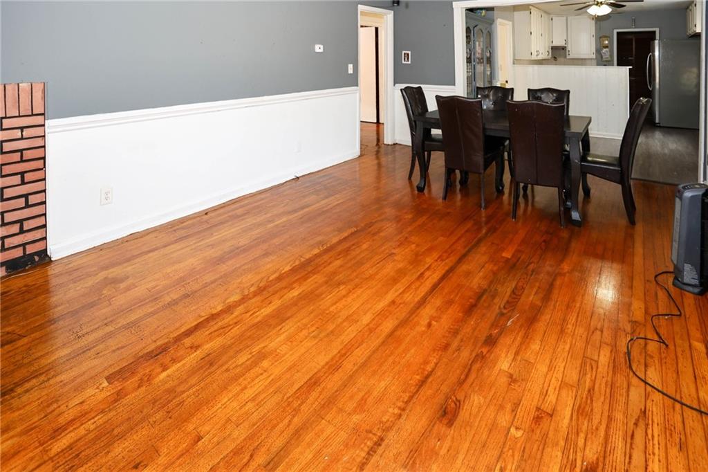 1368 West Austin Road Decatur, GA 30032 - Photo 8 of 42 a view of a dining room with furniture and wooden floor