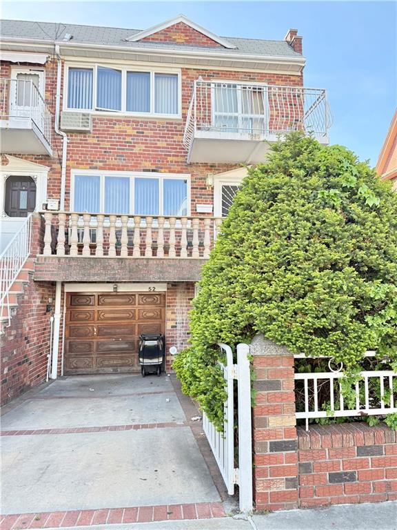 52 Bay 22nd Street Brooklyn, NY 11214 - Photo 1 of 20 a front view of a house with a garage