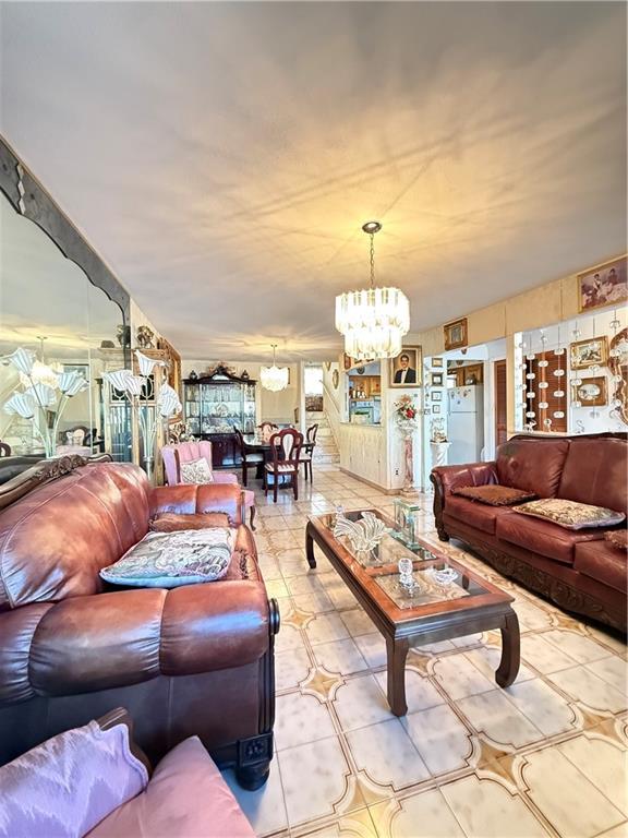 52 Bay 22nd Street Brooklyn, NY 11214 - Photo 13 of 20 a living room with furniture a chandelier and a dining table