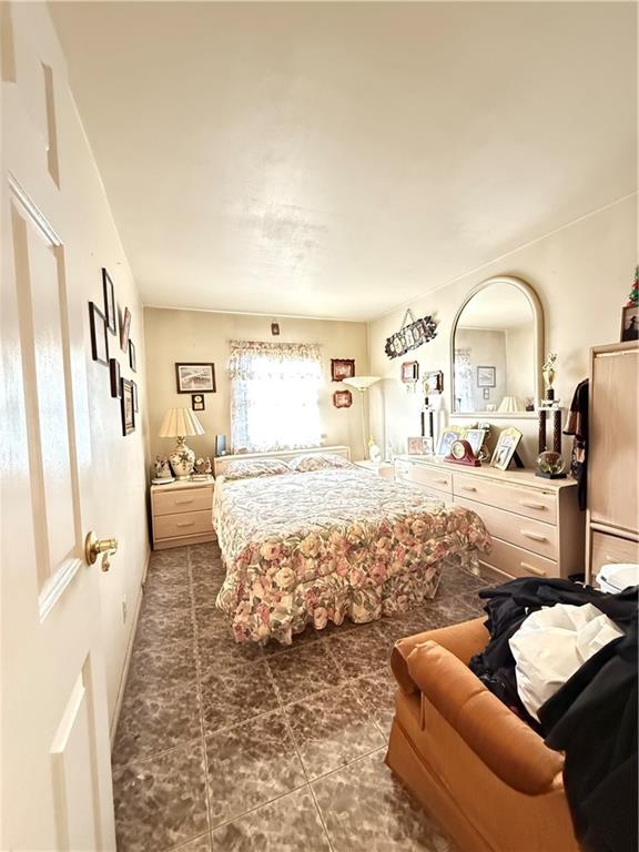 52 Bay 22nd Street Brooklyn, NY 11214 - Photo 15 of 20 a living room with furniture and a flat screen tv