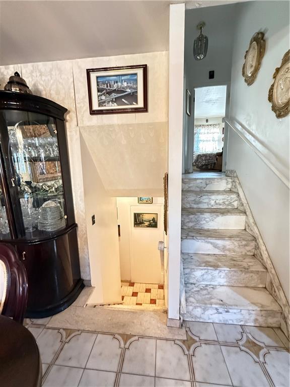 52 Bay 22nd Street Brooklyn, NY 11214 - Photo 18 of 20 a view of a hallway with painted walls and a refrigerator
