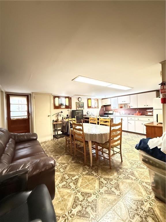 52 Bay 22nd Street Brooklyn, NY 11214 - Photo 19 of 20 a living room with furniture a view of dining room and kitchen view