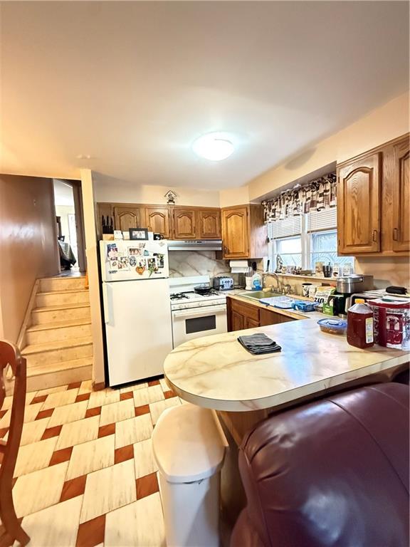 52 Bay 22nd Street Brooklyn, NY 11214 - Photo 3 of 20 a kitchen with stainless steel appliances kitchen island granite countertop a sink and cabinets