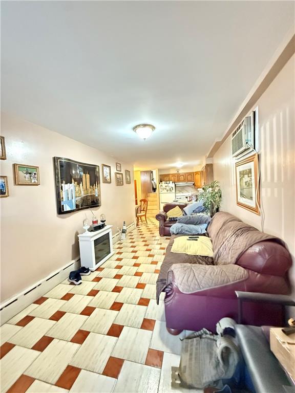 52 Bay 22nd Street Brooklyn, NY 11214 - Photo 4 of 20 a bedroom with furniture and a wooden floor