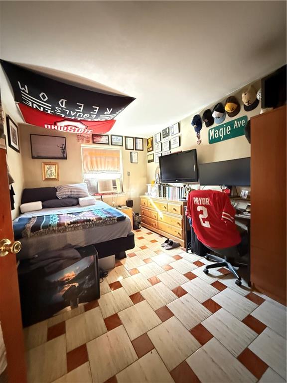 52 Bay 22nd Street Brooklyn, NY 11214 - Photo 8 of 20 a living room with a couch and a fireplace