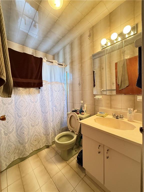 52 Bay 22nd Street Brooklyn, NY 11214 - Photo 9 of 20 a bathroom with a sink toilet and shower