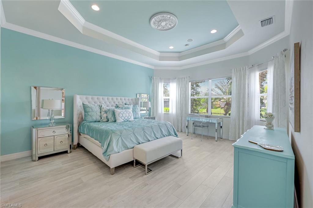 6582 Monterey Point Naples, FL 34105 - Photo 15 of 27 a spacious bedroom with a bed and window