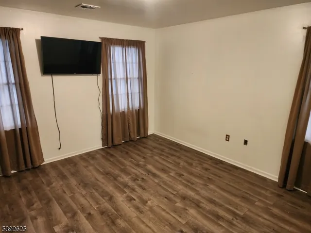 a bedroom with bed and a chandelier